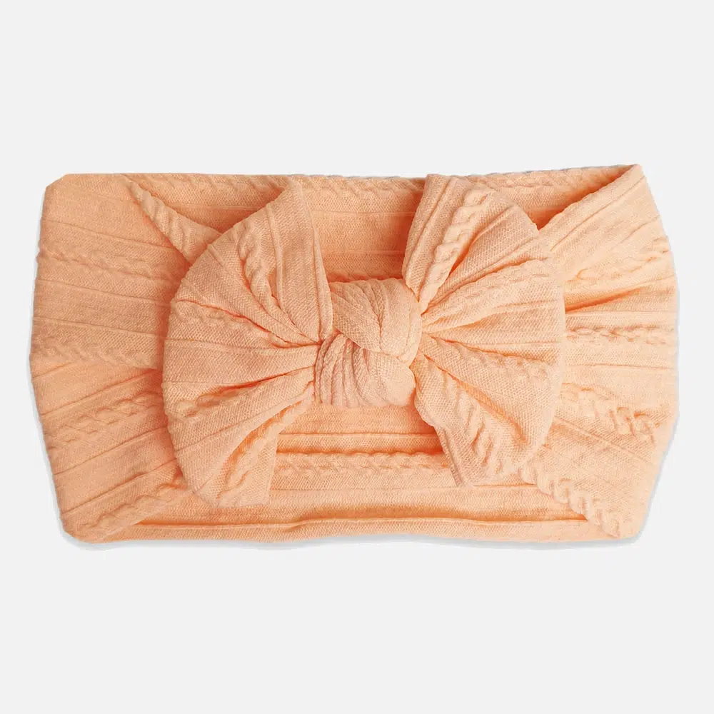Peach headband for baby Ferskenfarget hårbånd til baby